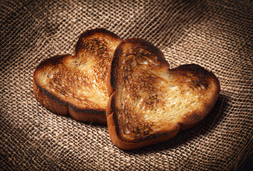 Poster - Two Heart shaped toast on burlap