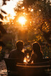 Romantic couple enjoying a sunset dinner outdoors.