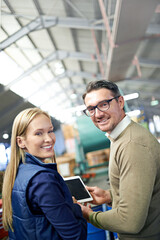 Poster - Warehouse, manufacturing and portrait of business people with tablet for logistics, ecommerce or distribution. Man, woman and smile with technology for quality assurance, teamwork or supply chain