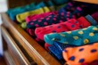 closeup of sock drawer with a mix of polka dot and solid colors