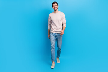 Aufkleber - Full length photo of satisfied cheerful handsome guy dressed white pullover jeans shoes go shopping isolated on blue color background
