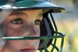 batters focused gaze from beneath helmet