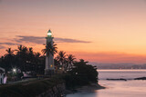 Fototapeta Londyn - Lighthouse in Galle fort at beautiful dawn. South coast of Sri Lanka..