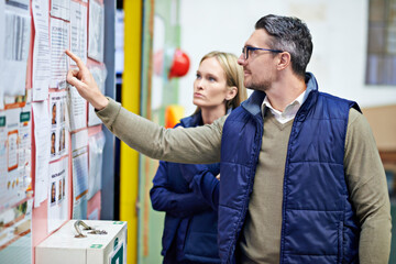 Aufkleber - People, planning and checking schedule with board in warehouse with calendar for order details. Man, woman and together with checklist or clipboard for supplier information and inventory updates