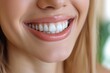 Close-up of a smiling woman showcasing her brilliant white teeth after a dental procedure