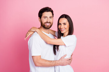 Canvas Print - Photo portrait of nice young couple hugging support each other wear trendy white outfit isolated on pink color background