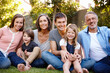 © peopleimages.com - Big family, happiness and portrait in garden for love or bonding, care and memories together. Generations, backyard and relax in summer for relationship growth or connection with unity and affection.