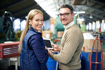 Poster - Man, woman and tablet in factory for team management in export business, check emails and delivery. Male person, portrait and female employee with technology for warehouse inventory or stock.