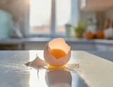 Fototapeta  - A raw egg broken on a sunny kitchen counter, with morning light casting a warm glow on the mess, a moment of chaos in the day's start