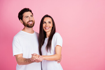 Sticker - Photo portrait of nice young couple hold hands hug look empty space dressed stylish white outfit isolated on pink color background