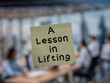 © maurice norbert - Post note on glass with 'A Lesson in Lifting'.
