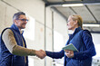 © peopleimages.com - Welcome, deal and business people with handshake for partnership, distribution or agreement. Professional, technology and shaking hands for export support, b2b networking or onboarding in warehouse
