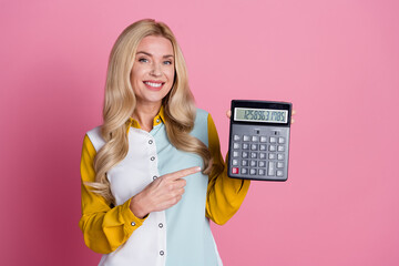 Wall Mural - Photo of gorgeous lovely woman economist wear stylish clothes hand hold calculator isolated on pink color background