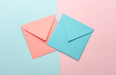 Wall Mural - Blue and pink square paper envelopes on blue pink pastel background