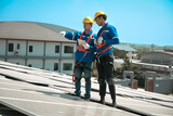Fototapeta  - Engineers install solae cell on the roof of factory