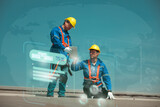Fototapeta  - Engineers or workers install and inspect solar cells on the roof of the factory.