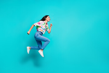 Sticker - Photo of crazy positive nice woman dressed stylish print clothes look empty space hurry isolated on cyan color background