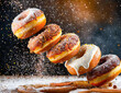 A close up of a pile of donuts with powdered sugar on top