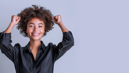 Wall Mural - Afro businesswoman wearing black shirt, smiling and raised hands