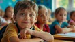 © pinkrabbit - primary elementary school group of children studying in the classroom. learning and sitting at the desk. young cute kids smiling, high quality photo