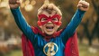 young boy in a superhero costume, triumphant pose