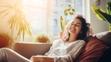 Fototapeta Niebo - Smiling female enjoying her day off while lounging on the couch at home; healthy lifestyle; positive energy from others; and fresh idea for a home .