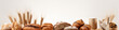 A collection of different types of bread and rolls displayed on a white surface, Various types of bread with large copy space