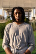 © Adrian Rodd/Stocksy - Portrait of black man with braids
