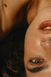 © Anastasia Mihaylova (Shpara)/Stocksy - Close Up woman's portrait with brown eyes in sun light, smiling woman