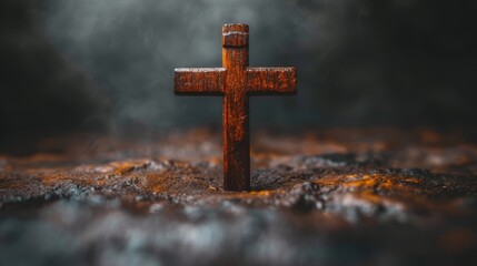   A wooden cross stands solitarily in the open field, smoke rising from behind it against a dark backdrop