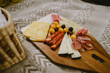© Felipe Barrera/Stocksy - cheese board to be shared