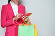 © Marc Tran/Stocksy - The concept of women shopping and holding bags