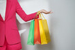 © Marc Tran/Stocksy - unrecognizable shopaholic woman carrying purchases