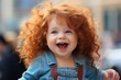 © Ilia K - Joyful little girl with curly red hair smiling in a sunny park on a beautiful summer day