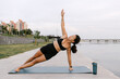 © Julia Volk/Stocksy - Fit Woman Stretching Body