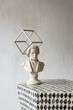 © Jodie Johnson Photography/Stocksy - Marble statue ornament conceptual still life