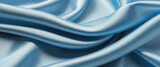 Fototapeta  - Blue wave swirl silk background, smooth satin texture with drapery. Light blue color flow, realistic.