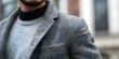 Closeup of a mans stylish outfit blending sportswear with a sophisticated blazer for a chic street fashion look. Concept Street Fashion, Men's Style, Sporty Chic, Blazer and Sportswear