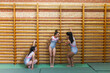 © Lupe Rodríguez/Stocksy - group of teenage gymnasts training