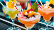 Closeup of three creative healthy but sweet exotic non alcoholic party cocktails at restaurant background glasses on bar refreshing drinks with straws