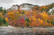 Paddling Canoe with Colorful Wilderness Autumn Forest