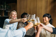 © Studio Firma/Stocksy - Group of people toasting