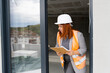 © Jelena Markovic/Stocksy - Woman engineer inspecting constraction site