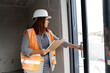© Jelena Markovic/Stocksy - Woman engineer inspecting constraction site