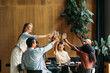 © Studio Firma/Stocksy - Group of people toasting