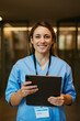 © BONNINSTUDIO/Stocksy - Portrait of confident female nurse