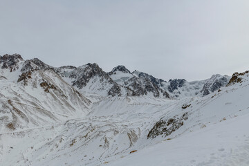 Wall Mural - Winter mountain landscape. Peaks, rocks and glaciers. Kazakhstan nature.