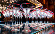 A lot of martini glasses stand on the bar red syrup blue rim on the glasses