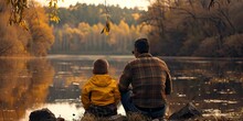 Father And Son Fishing On The Lake 