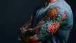 Detailed close-up of a man's colourful tattooed sleeves featuring vibrant traditional Japanese designs